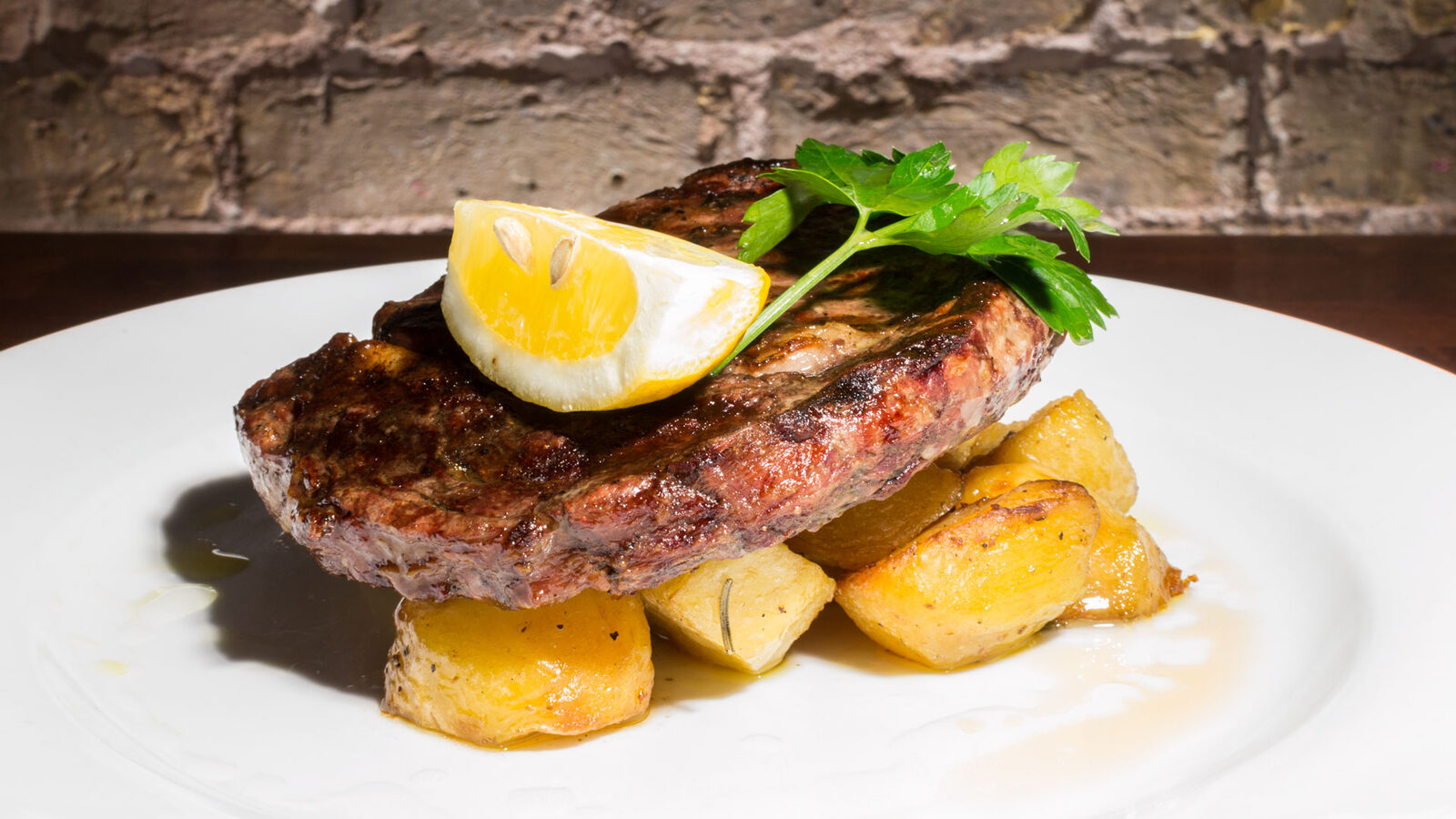 Steak with fried egg and roast potatoes