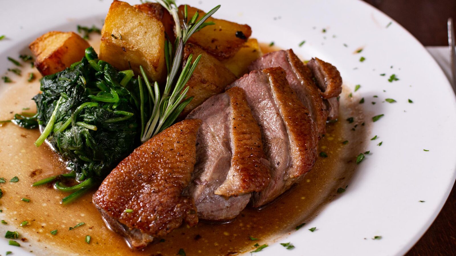 Pan-seared duck breast with roast potatoes